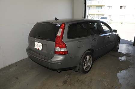 rear photo of grey Volvo station wagon