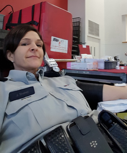 Sgt. Janelle Shoihet donating blood at the BC RCMP Blood Donor Clinic.
