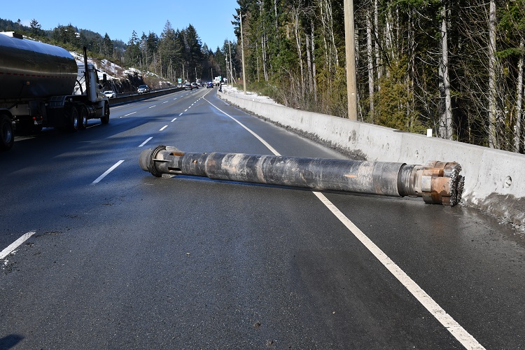 Trans Canada Highway northbound with large drill bit laying across lanes.